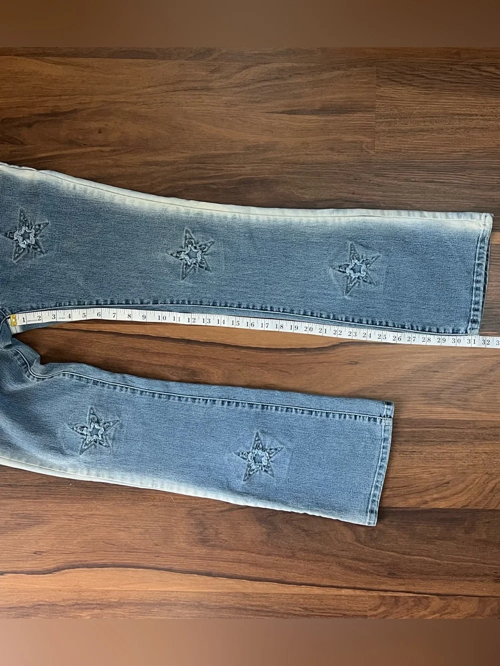 Vintage Y2K Street Code jeans with distressed star patch details
